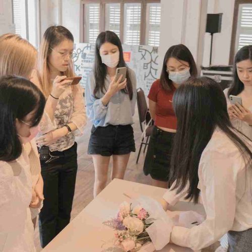 Chloe (right) giving out instructions to her students in one of her workshops. (Photo credits: Chloe)